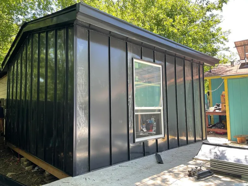 Black standing seam metal wall panels for Roof Inspection in Gloucester